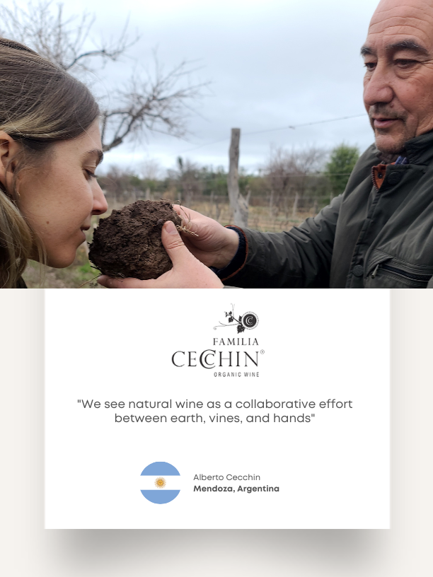 Familia Cecchin examining vineyard soil. Their card describes natural wine as a collaboration between earth, vines, and hands.
